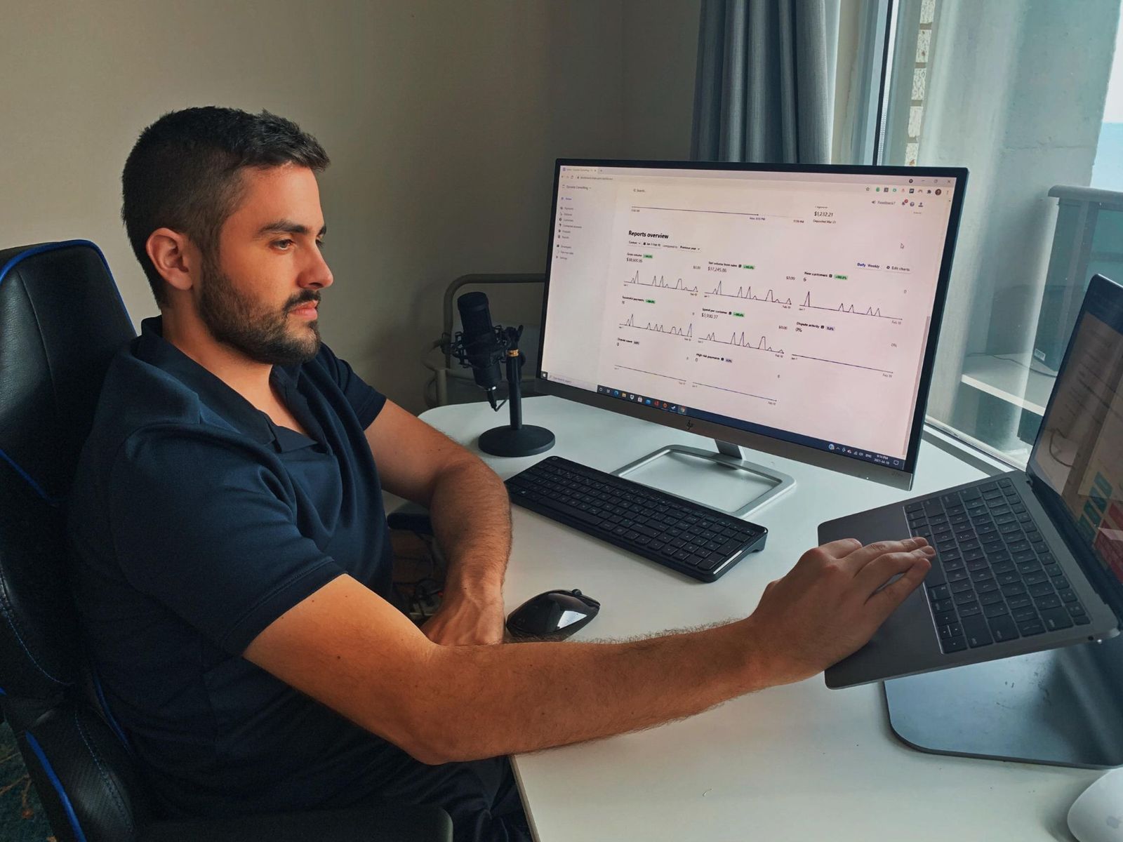 Desmond Legge building revenue systems at his desk